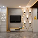 TV unit interior design with beige, light brown and dark brown theme. Mandir on left and small buddha statue on right side.